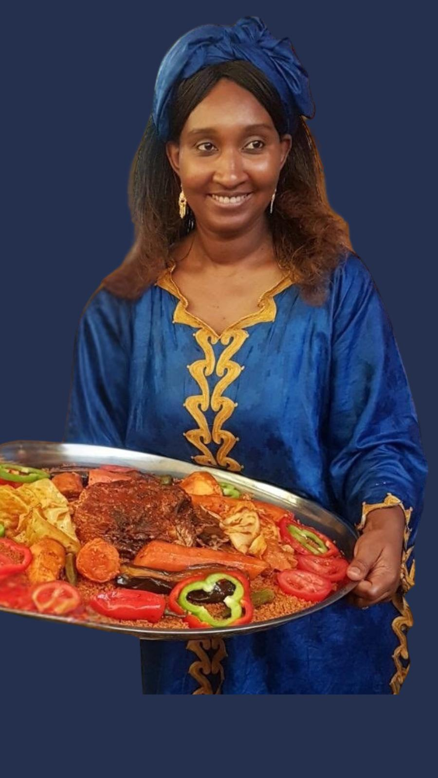 Aissatou Ba presenting a traditional Thieboudienne platter